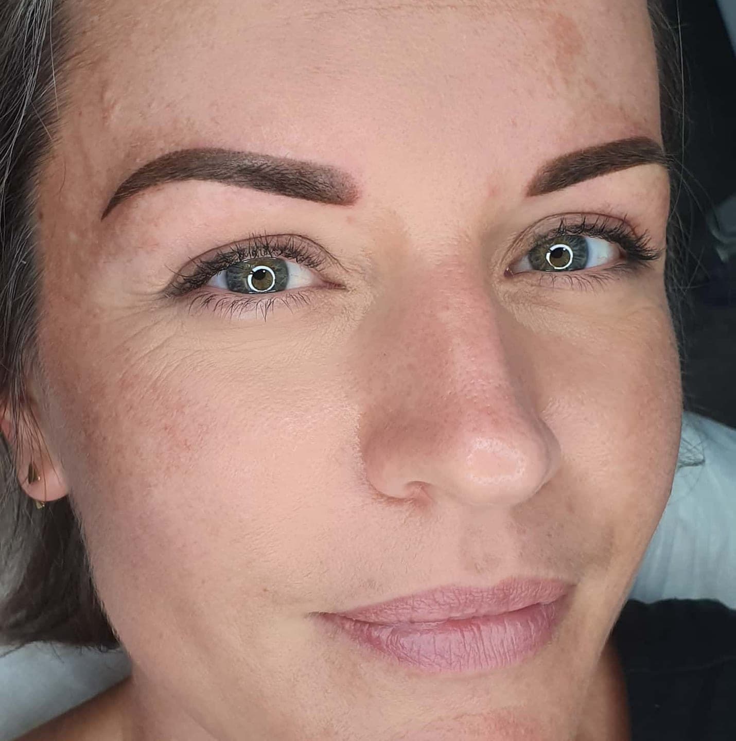 Client with softly shaded, healed brows