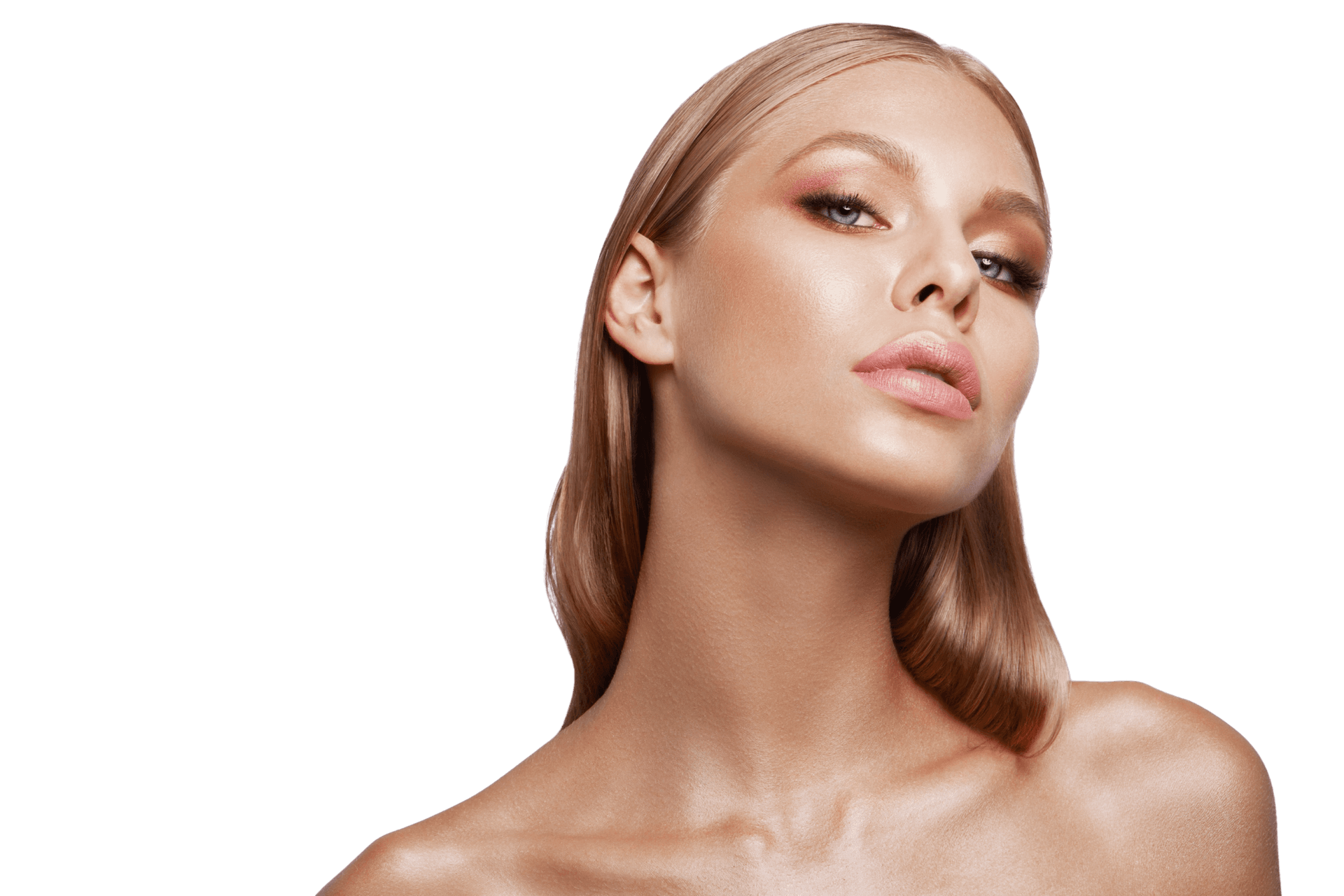 A woman with defined brows, eyeliner and full lips, tilting her face toward the camera