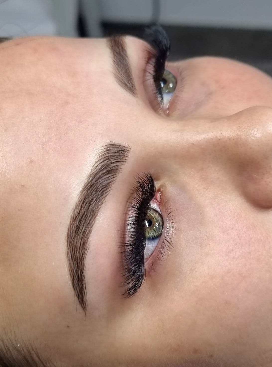 Freshly tattooed hair-stroke brows, seen from above